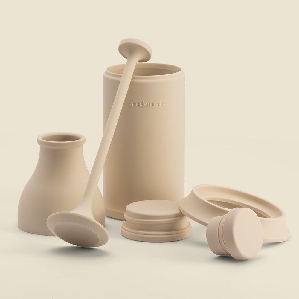 milkpress cream-colored silicone parts in an artistic arrangement