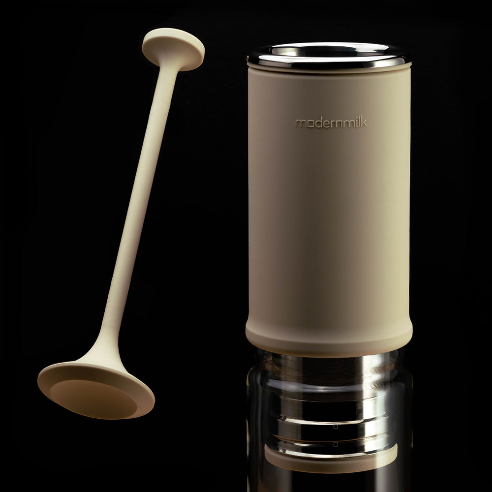 milkpress extension collar and milkstick suspended in air