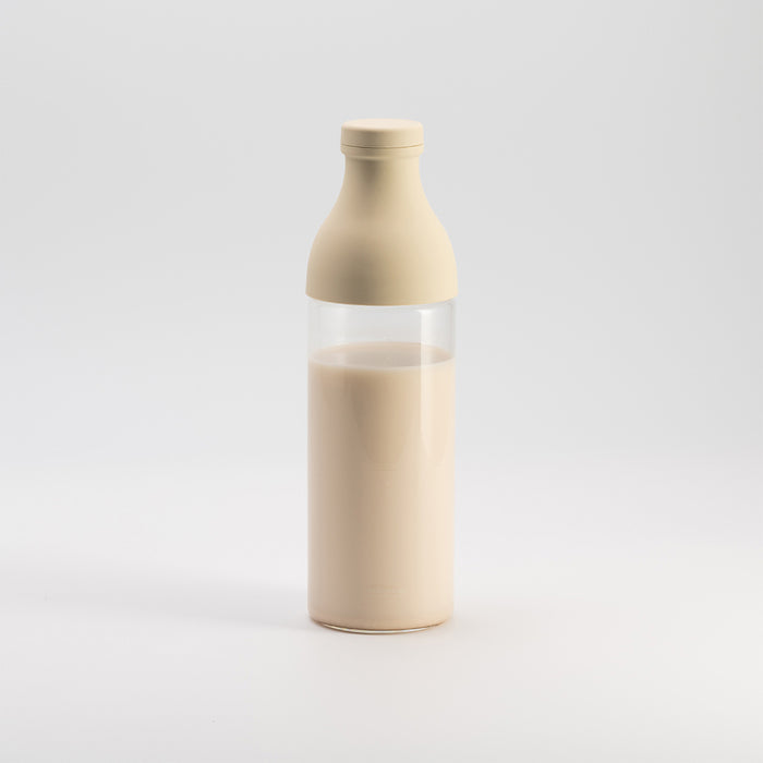 milkpress bottle filled with almond-macadamiamilk